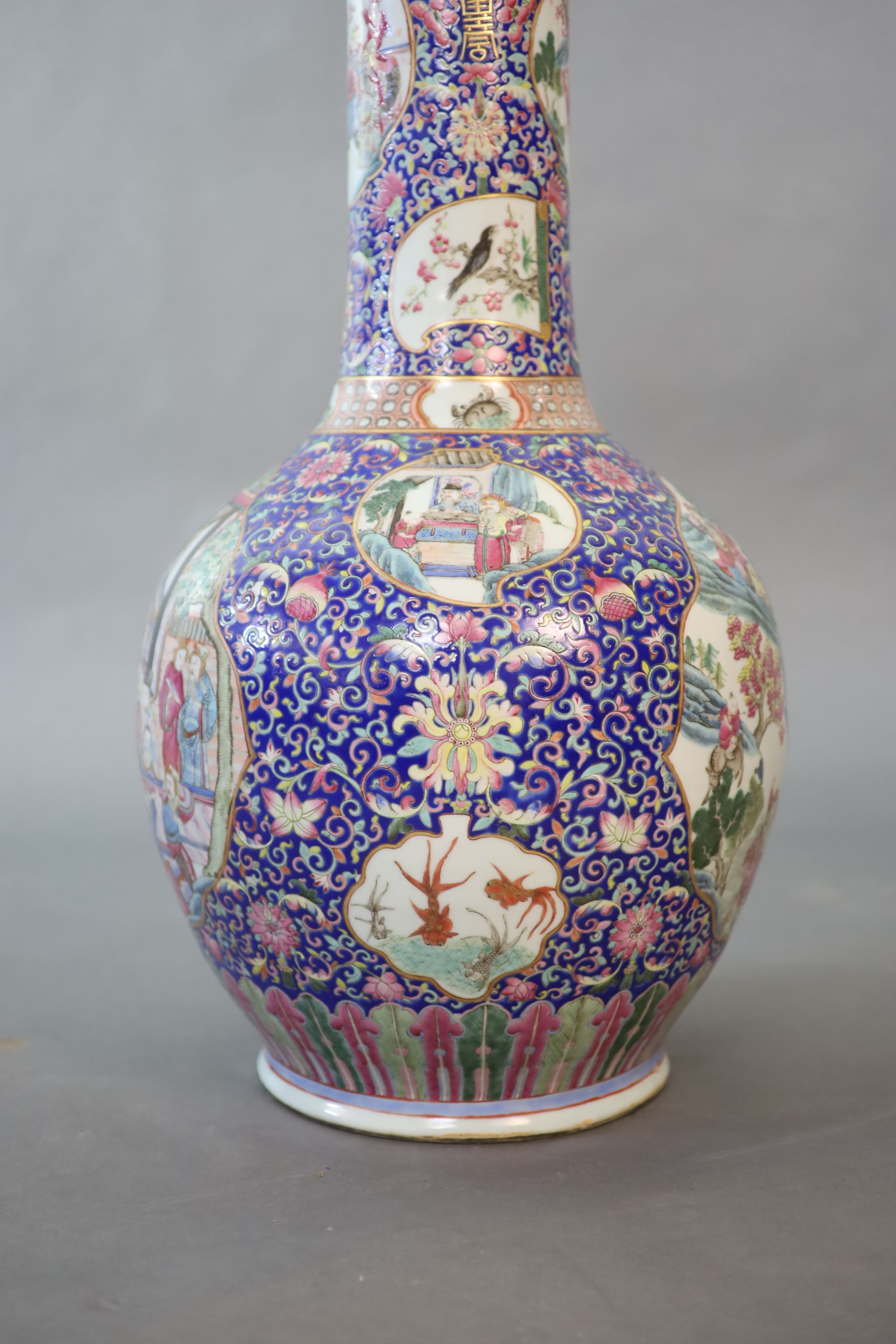 A massive Chinese blue ground bottle vase, Daoguang period (1821-50), 88cm high, neck broken and re-glued